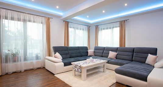 A living room illuminated by LED lights.