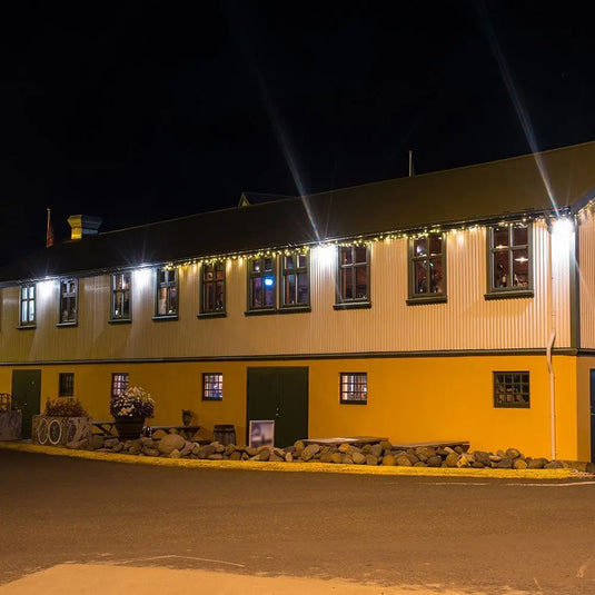 30w LED Floodlight With Samsung LEDs - 5 Year Warranty LED Flood light mounted on the wall, outside setting at night