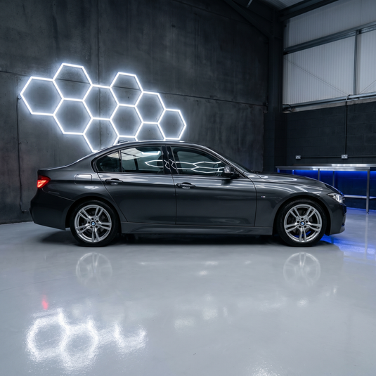 Side view of 11 hexagon LED lights above a car