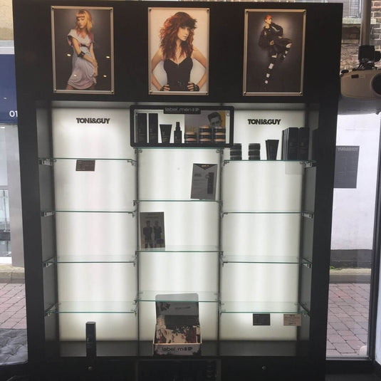 Display cabinet lit from behind with LED tape