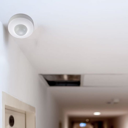 Surface mounted PIR sensor fitted on a ceiling