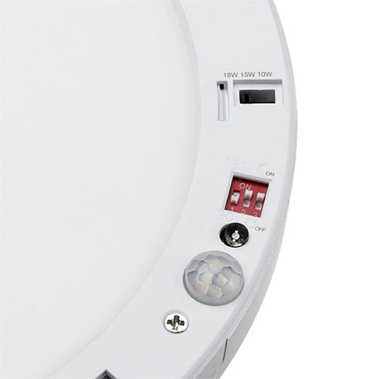 Close up of the downlight bezel with its controls