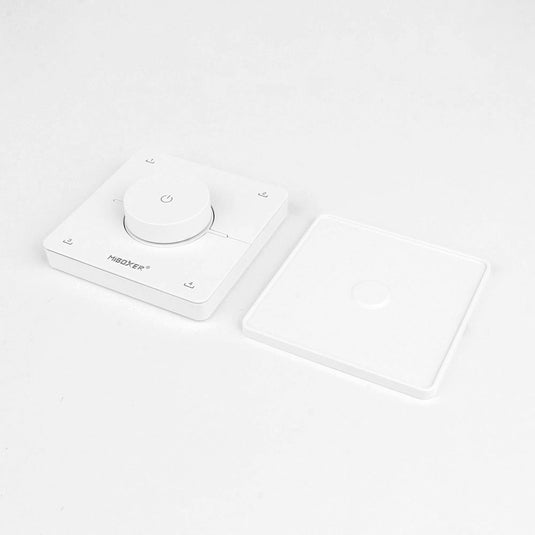 Wall remote beside its magnetic plate