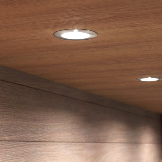 Natural white under cabinet lights below wooden cabinets