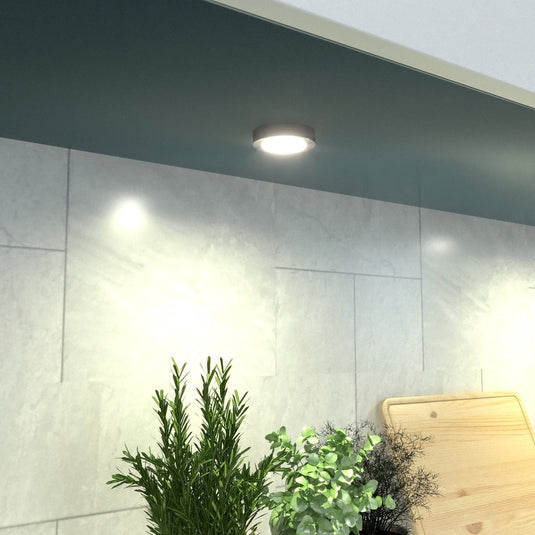 Single surface mounted under cabinet light in brushed chrome