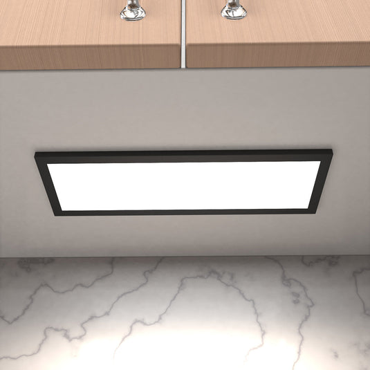 Close up of a cabinet light under a kitchen cabinet