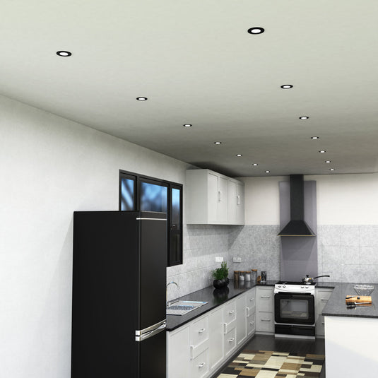 Side view of a kitchen with black downlights