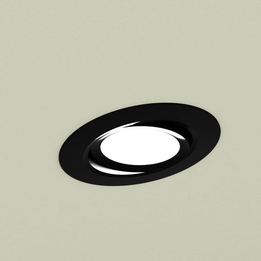Close up of a black tilt downlight in a ceiling