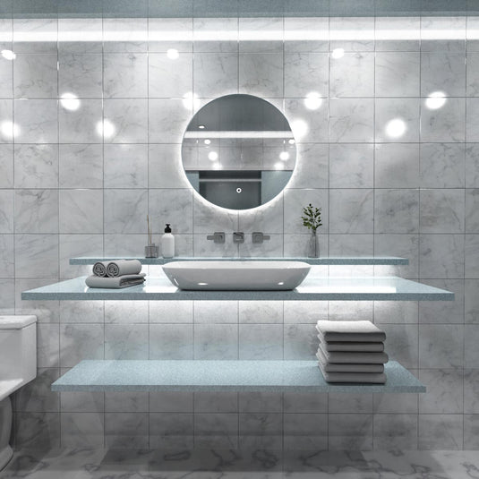 Luxe, 600mm LED Bathroom Mirror - Brushed Silver above the sink in natural white light