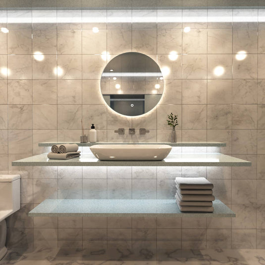 Luxe, 600mm LED Bathroom Mirror - Brushed Silver above the sink in warm white light