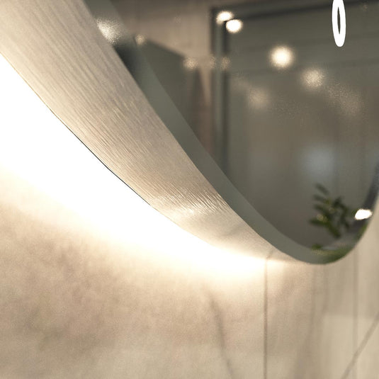 Luxe, 600mm LED Bathroom Mirror - Brushed Silver close up shot on the frame, in warm white light
