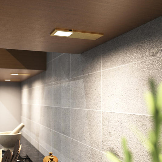 Natural white brass cabinet light, close view