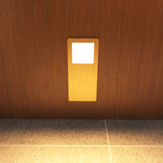Warm white brushed brass cabinet light, close view