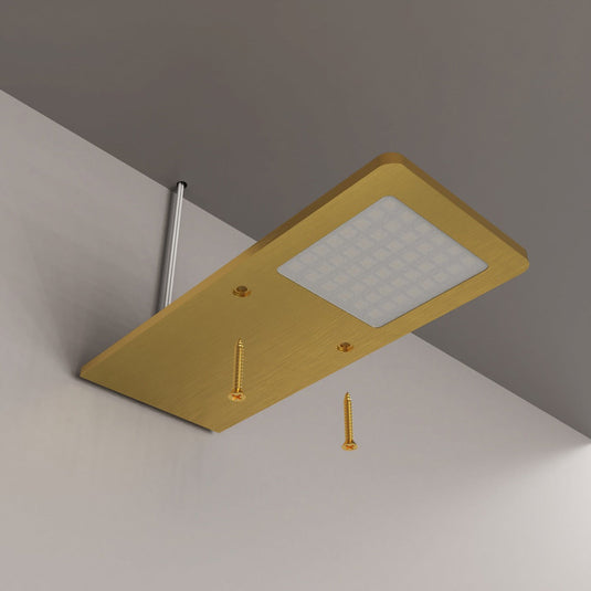 Brass cabinet light with its two fixing screws