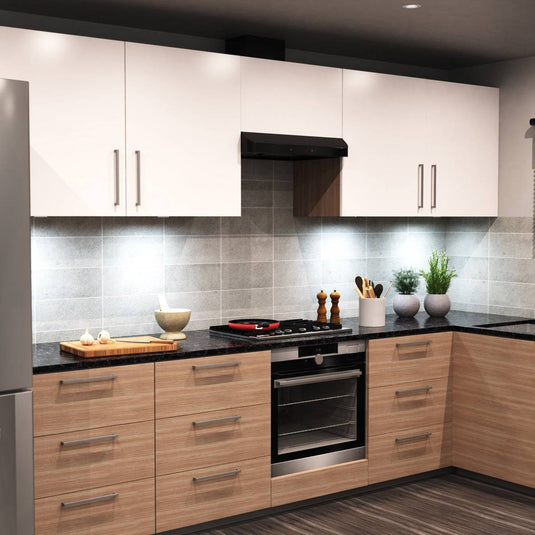 Side view of a kitchen with cool white under cabinet lights