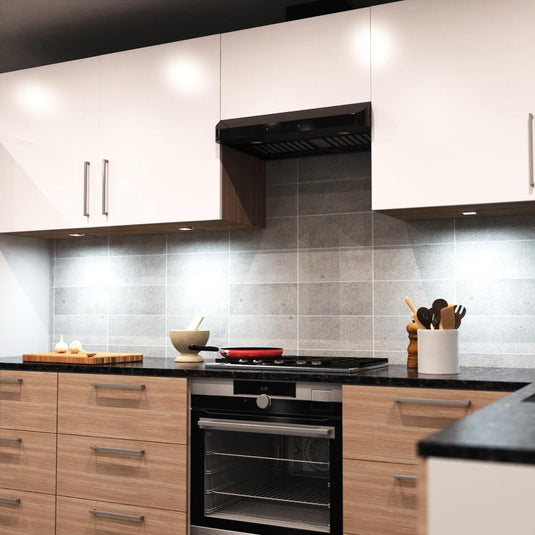 Run of kitchen units with cool white lights underneath