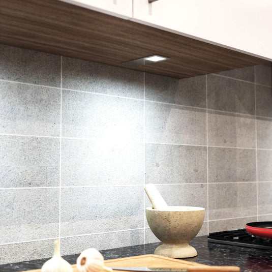Cool white light falling on a worktop
