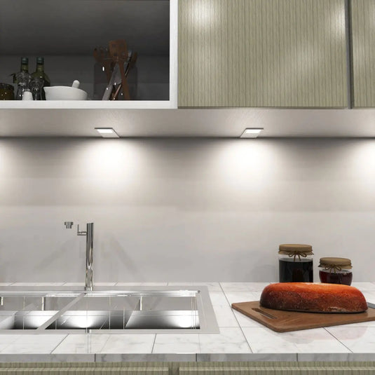 Recti Superslim 5w LED Cabinet Light, Matte White, above the sink setting in natural white light