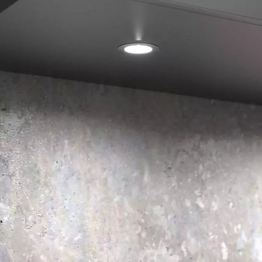 Close up of a mounted recessed type led  cabinet light with cool white light