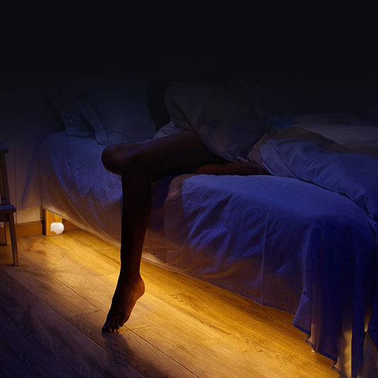 PIR sensor mounted at the foot of a bed