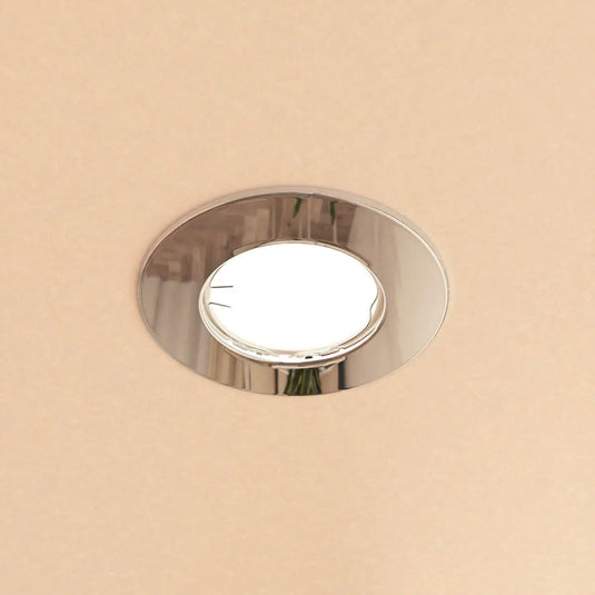 Fire Rated Downlight, GU10, Fixed - Polished Chrome in warm white light mounted in ceiling