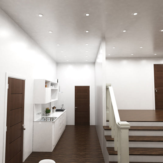 Hallway lit by white fire rated downlights