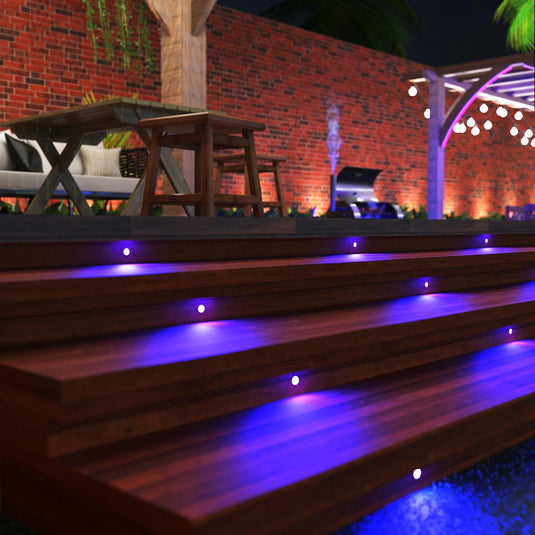 Decking steps lit by blue mini deck lights