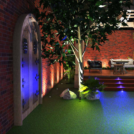 Garden with a spike light lighting a tree