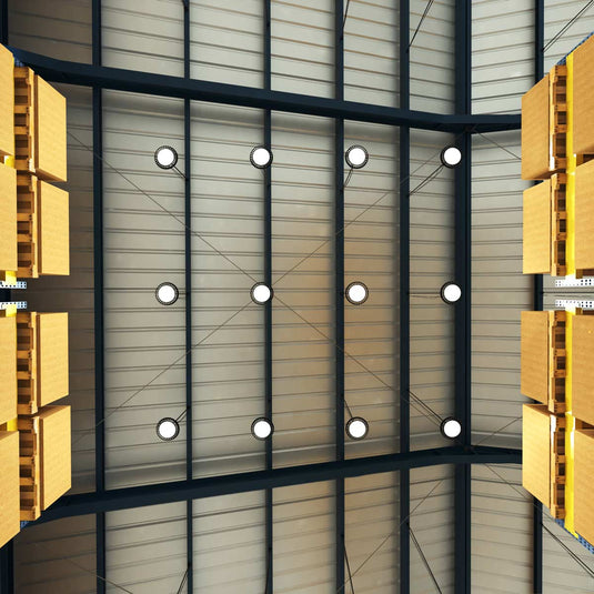 Row of LED high bays on a warehouse ceiling