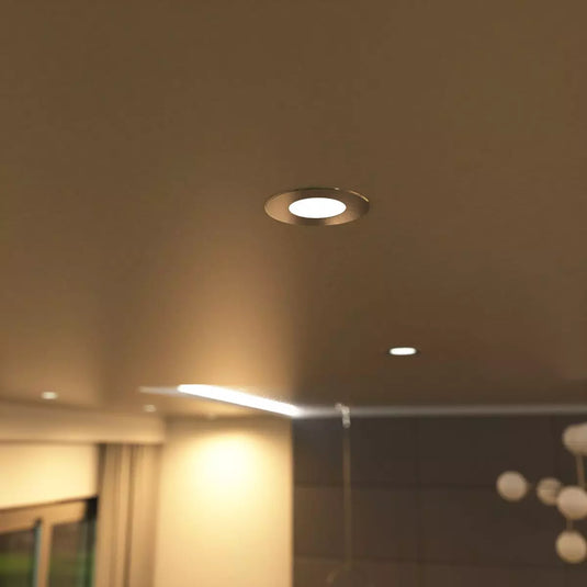 Mounted warm white brushed chrome downlight