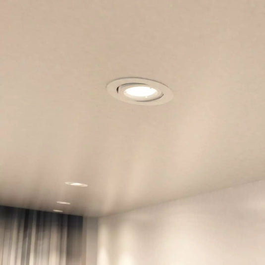 mounted in ceiling with White GU10 Tilt Downlight in natural white light