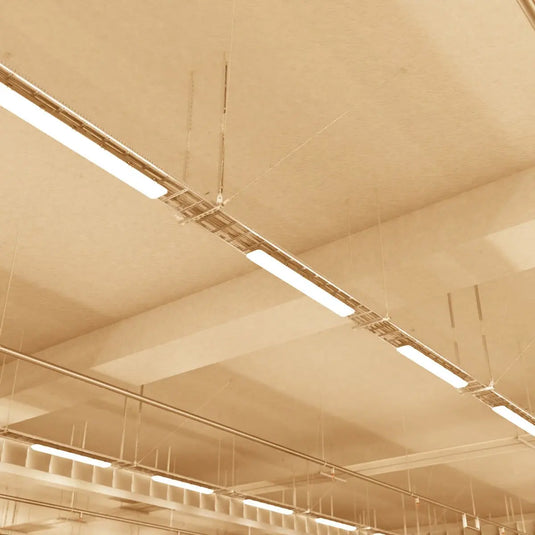 NCF IP65 LED Batten with Microwave Sensor in warm white light suspended on the ceiling