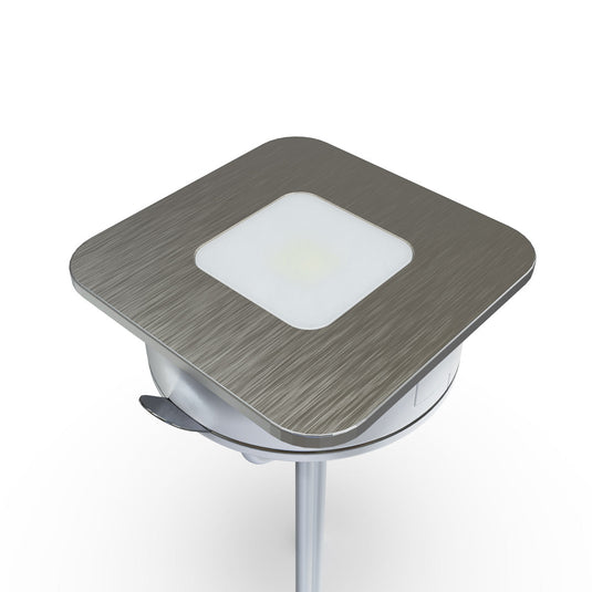Side of a square brushed chrome plinth light
