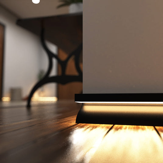 Close up of black skirting profile lit in warm white