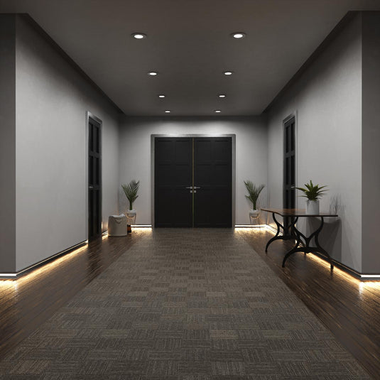 Entryway with silver skirting profile lit in warm white