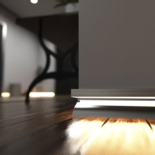 Close up of silver skirting profile lit in warm white