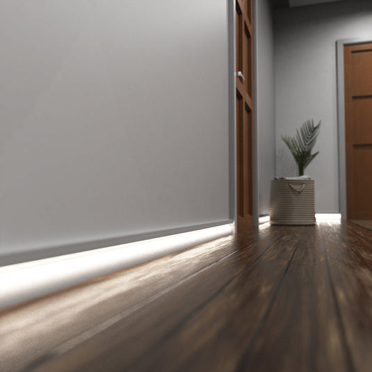 Hallway with white skirting profile lit in natural white