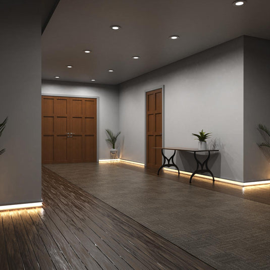 Entryway with white skirting profile lit in warm white