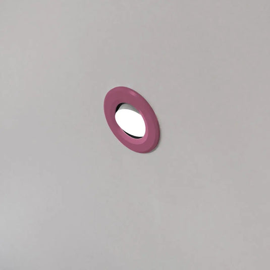Tilt, Fire Rated LED Downlight - Pink Bezel mounted in ceiling