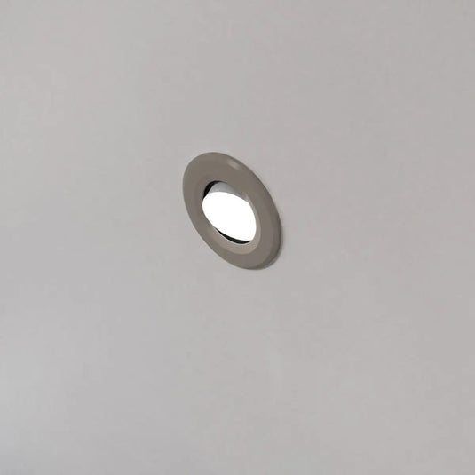 Tilt, Fire Rated LED Downlight - Light Grey Bezel mounted in ceiling