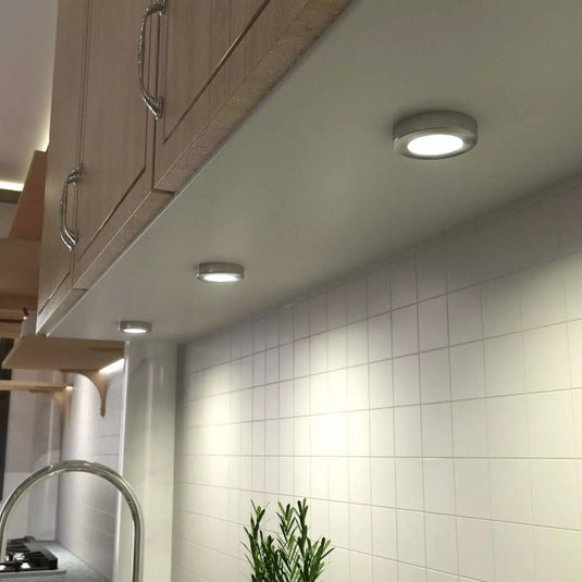 Kitchen counter cabinet with surface mounted under cabinet light in warm white light