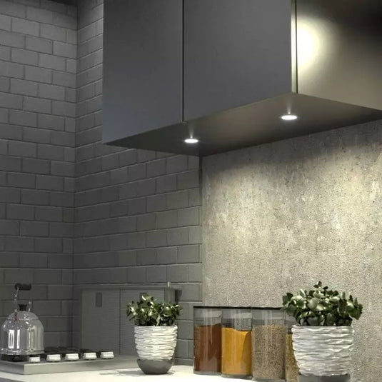 Mid close up of a mounted recessed type led cabinet light with warm white lights