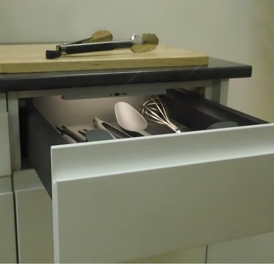battery powered under cabinet light under a drawer