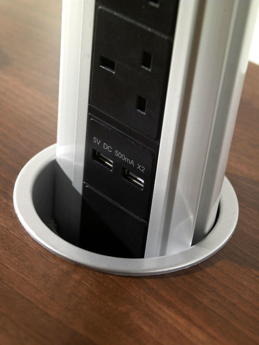 close up of two USB ports in a pop up socket