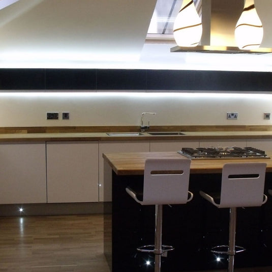 mid view of a kitchen with cool white LED strip lights
