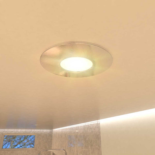 fire-rated downlight in brushed chrome with warm white light