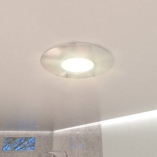 fire-rated downlight in brushed chrome with natural white light