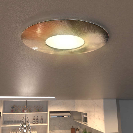 brushed chrome fire-rated downlight in warm white light