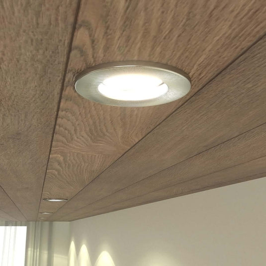 Fire rate downlight in brushed chrome with warm white light