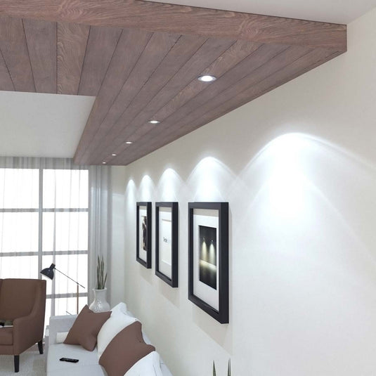 Fire rated downlights with a cool white light installed in a wood ceiling